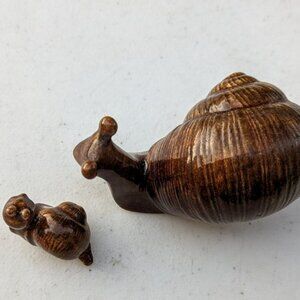 Brown ceramic snails (2)